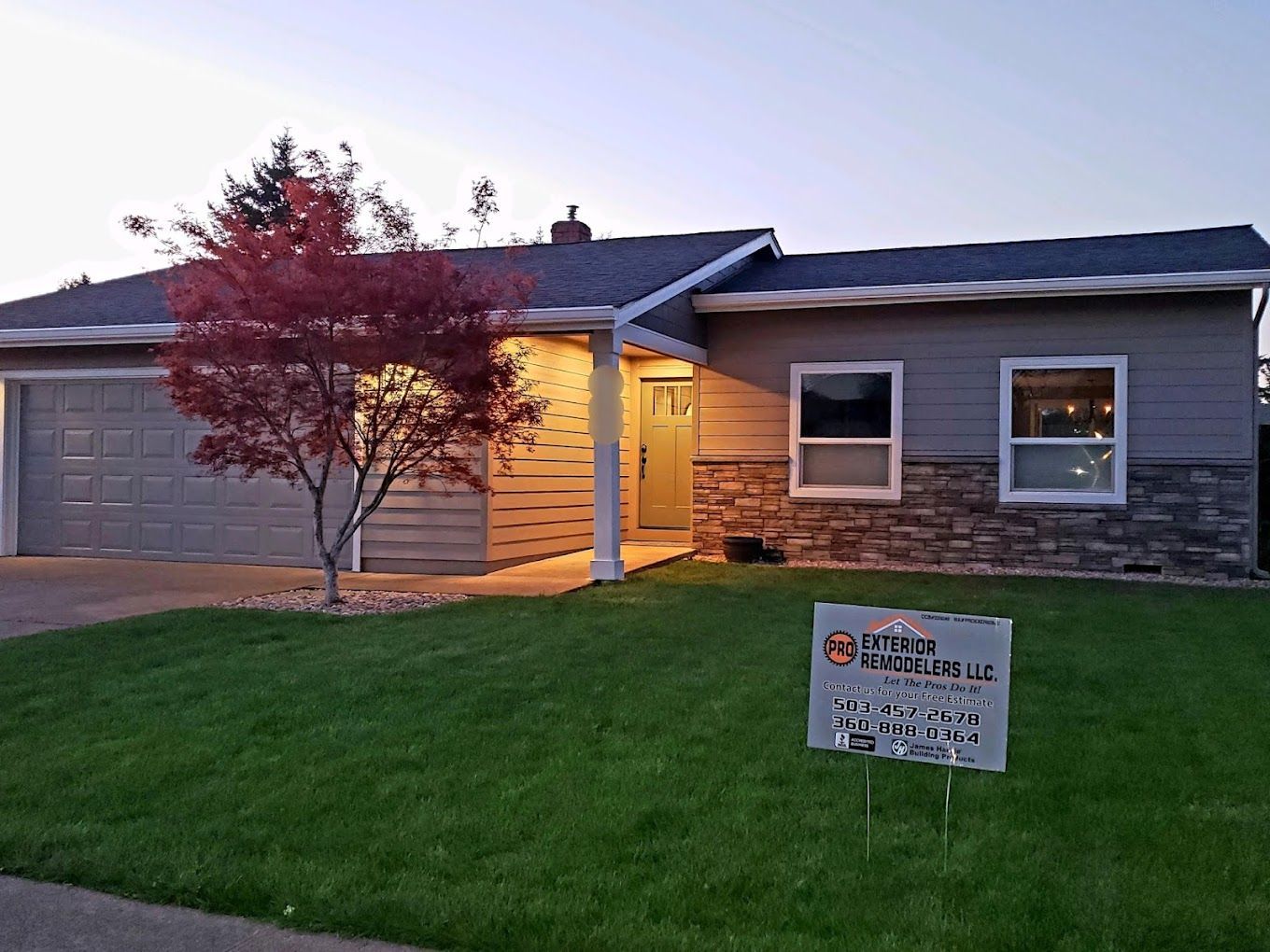 A house with a sign in front of it is for sale.
