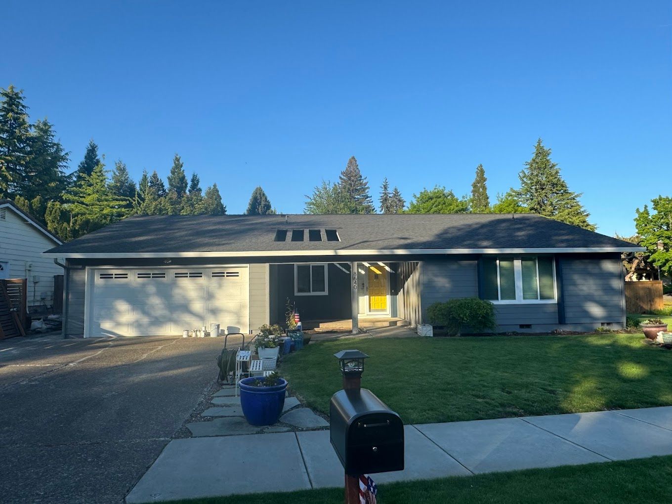 A large house with a mailbox in front of it.