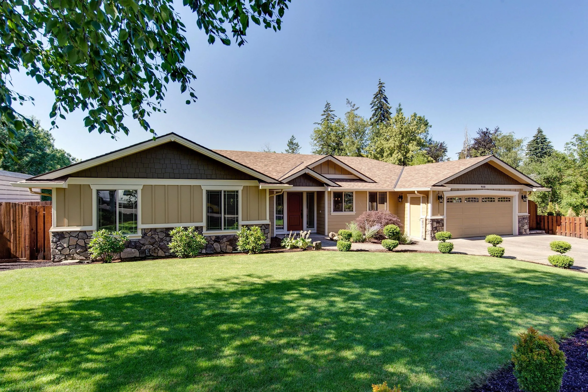 A large house with a large lawn in front of it
