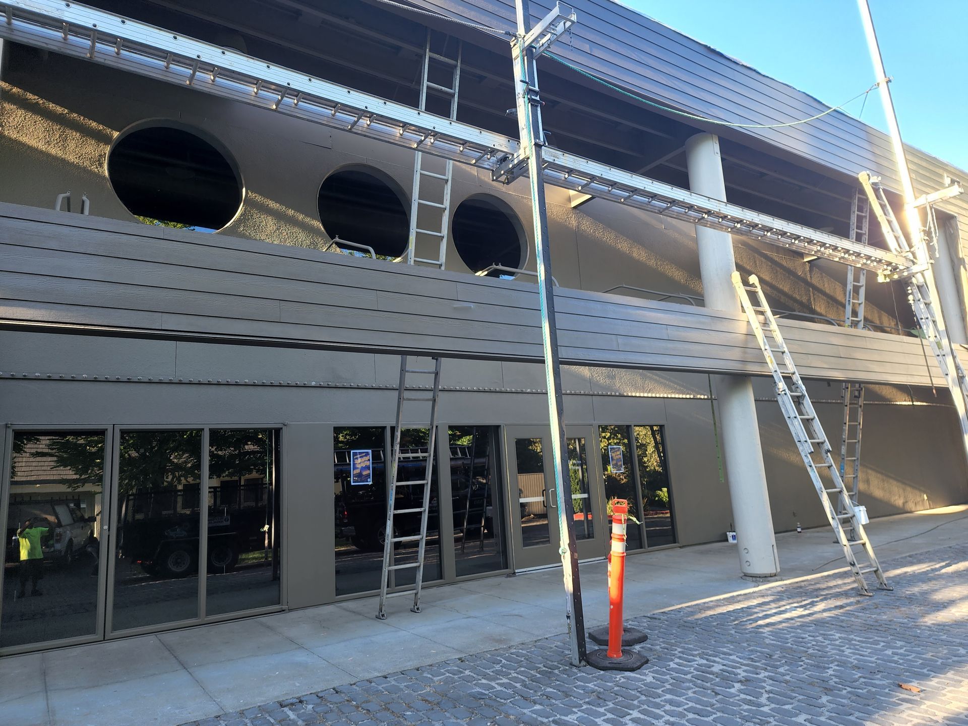 A building under construction with a ladder on the side of it