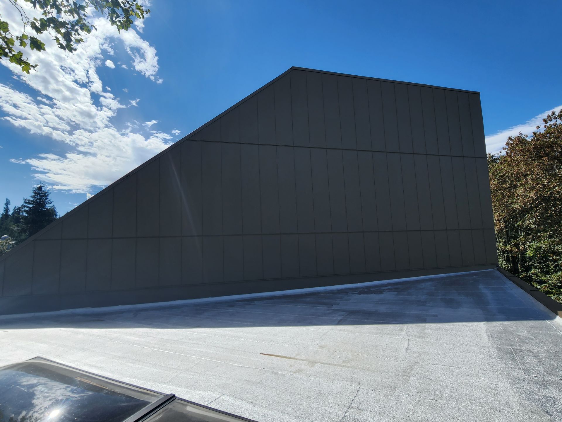 A large building with a blue sky in the background