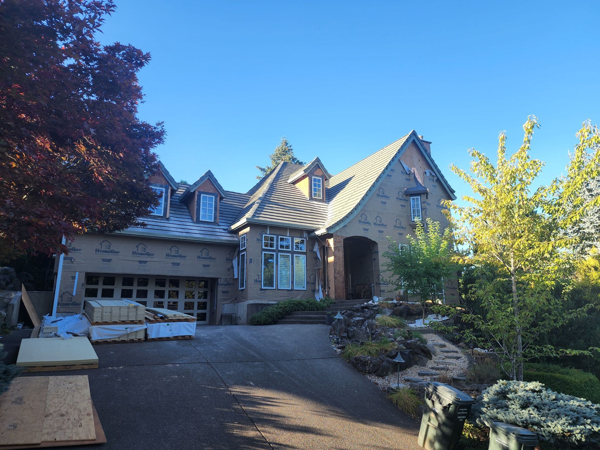 A large house with a lot of boxes in front of it