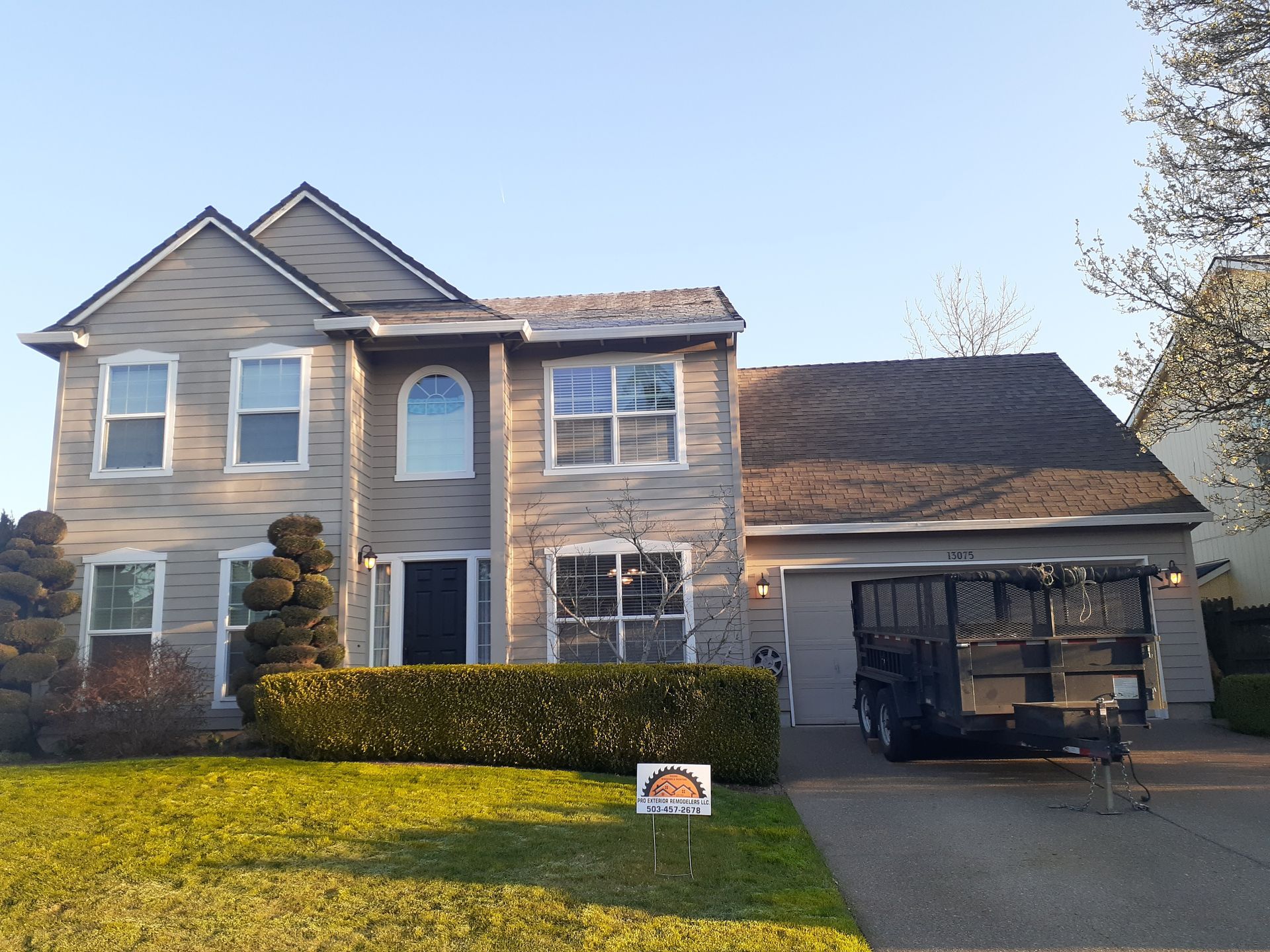 A large house with a truck parked in front of it