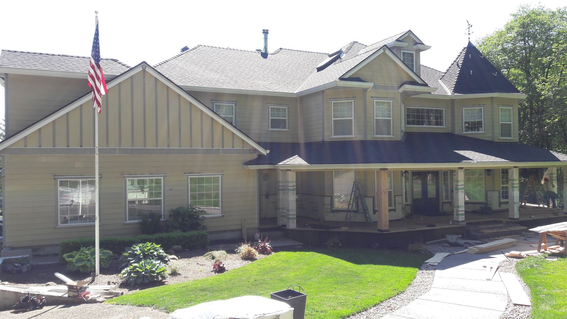 A large house with a flag in front of it
