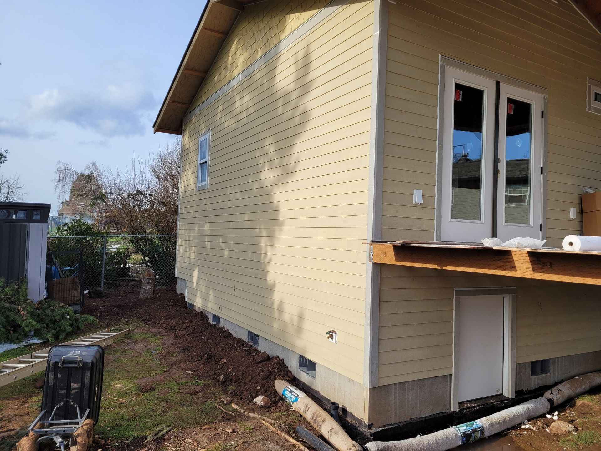 The side of a house with a sliding glass door