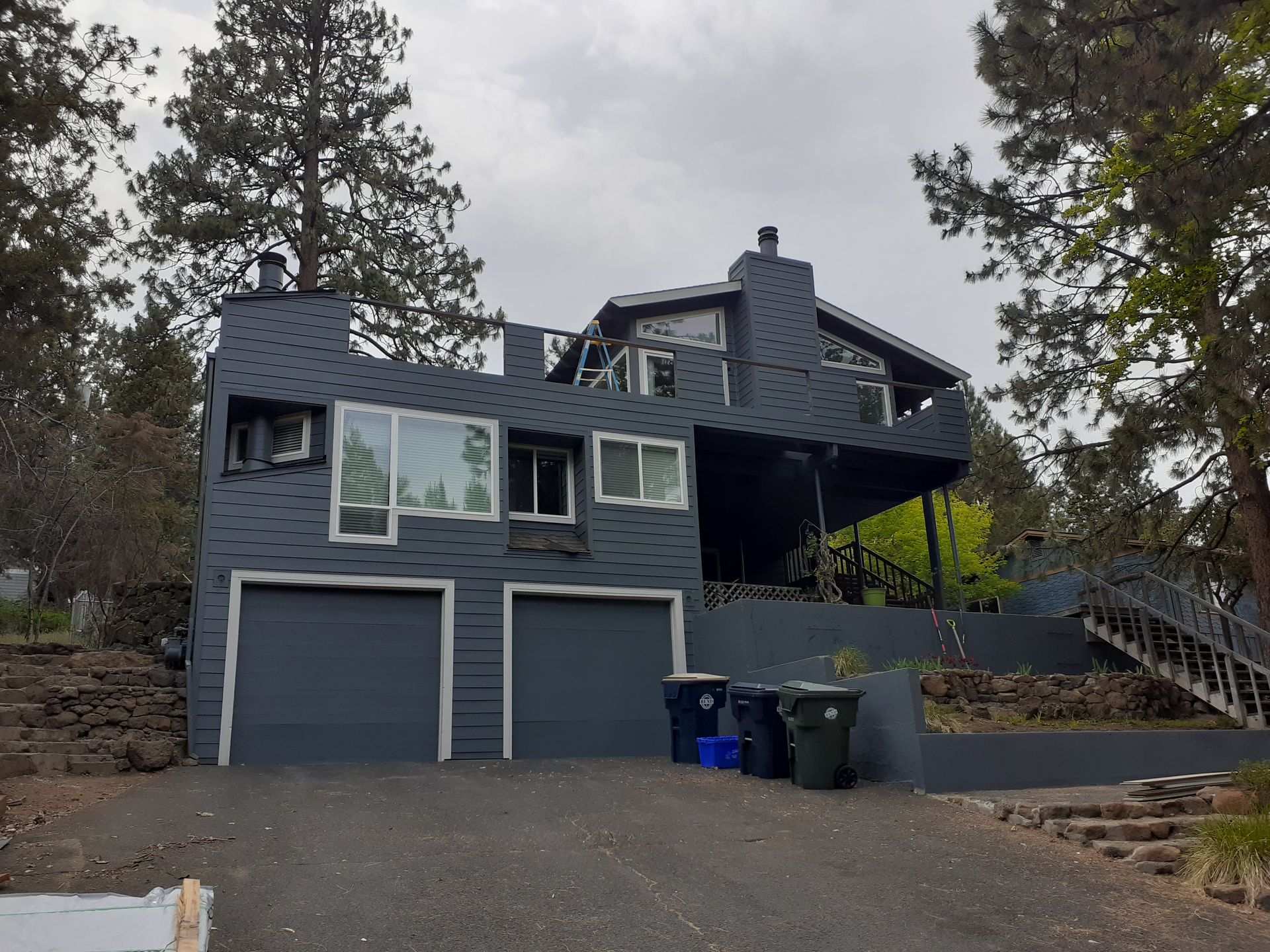 A large house with a lot of windows and stairs