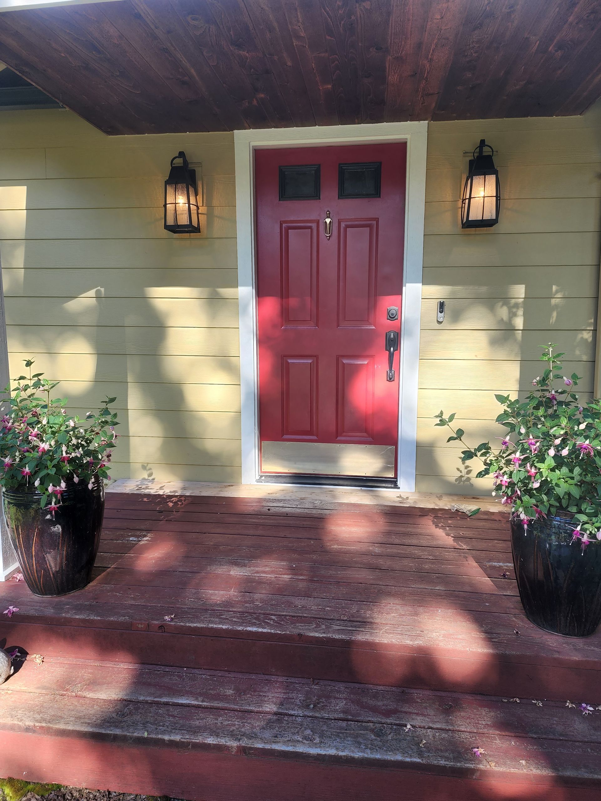 The front door of a house with a red door