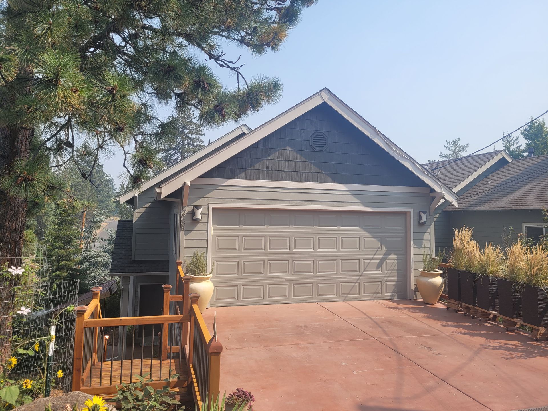A house with a large garage door and a driveway