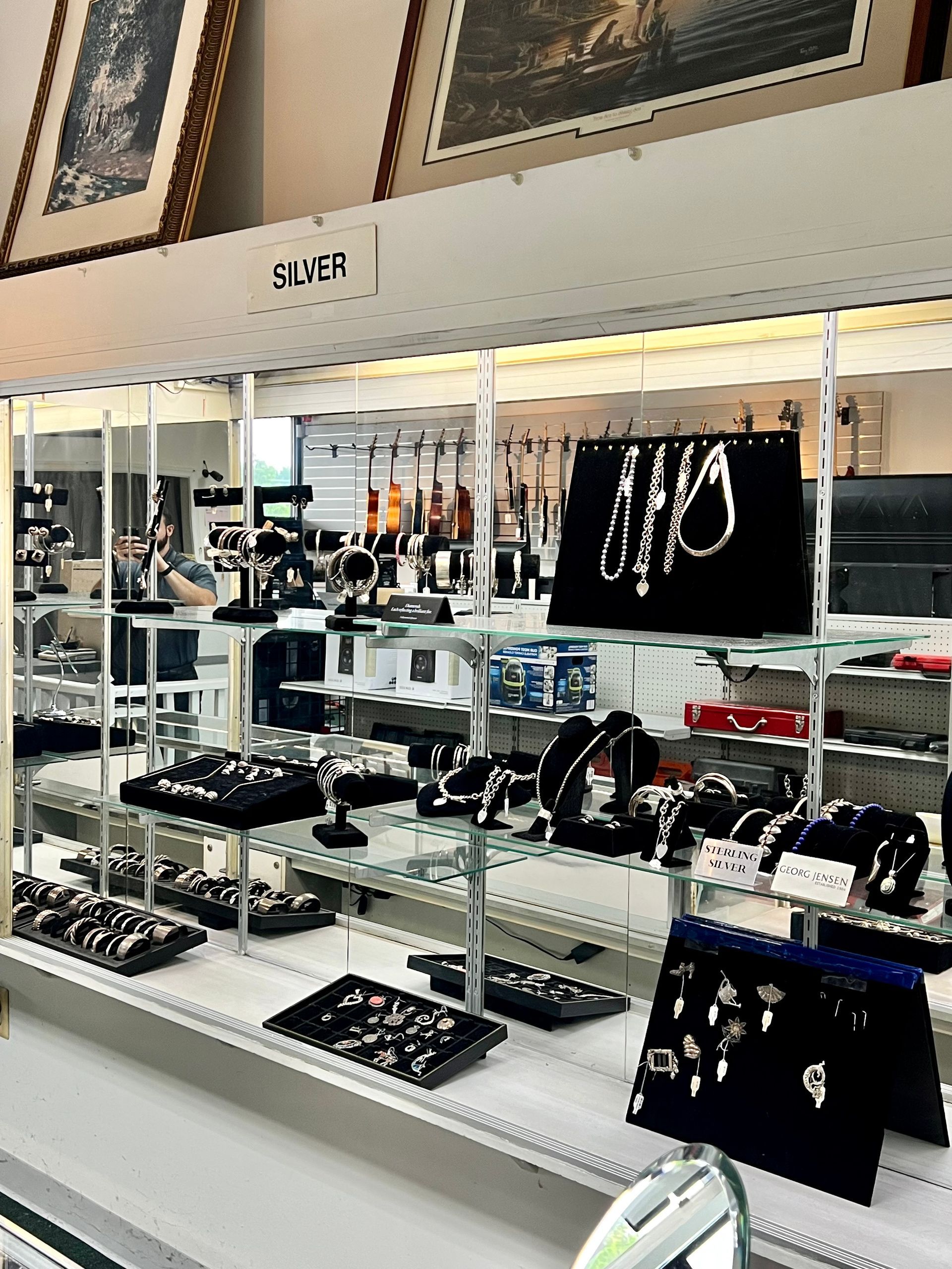 A display of silver jewelry in a store