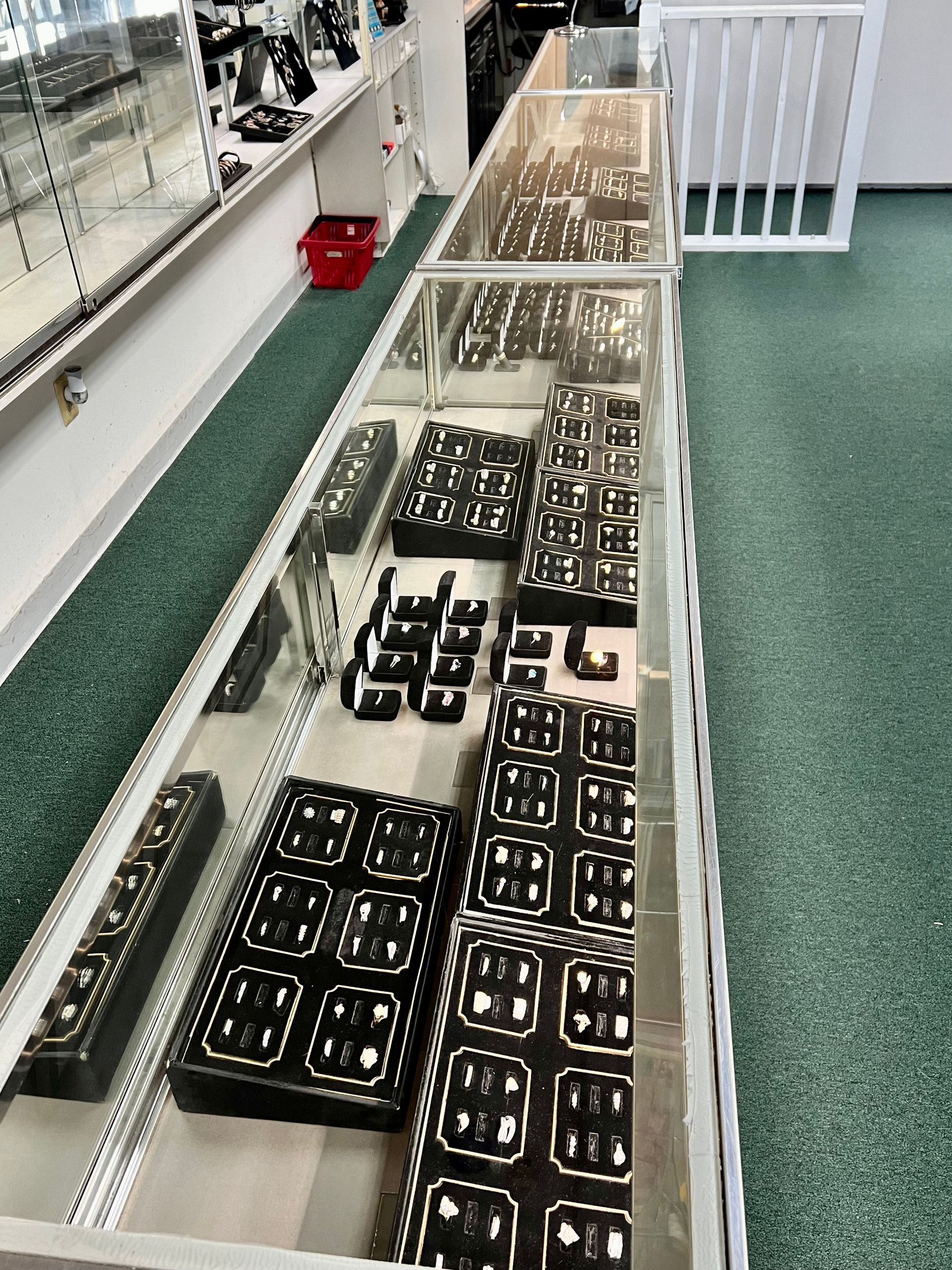 A long display case with a lot of jewelry on it
