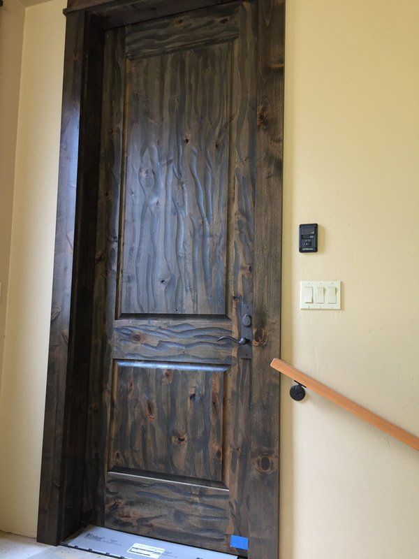 Massive Nine-Foot Rustic Alder Door, Stained Dark to Emphasize Distressing