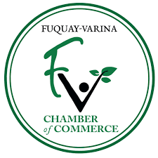 Fuquay-Varina Chamber of Commerce logo. Green and black “FV” with a leaf, surrounded by a green circle.