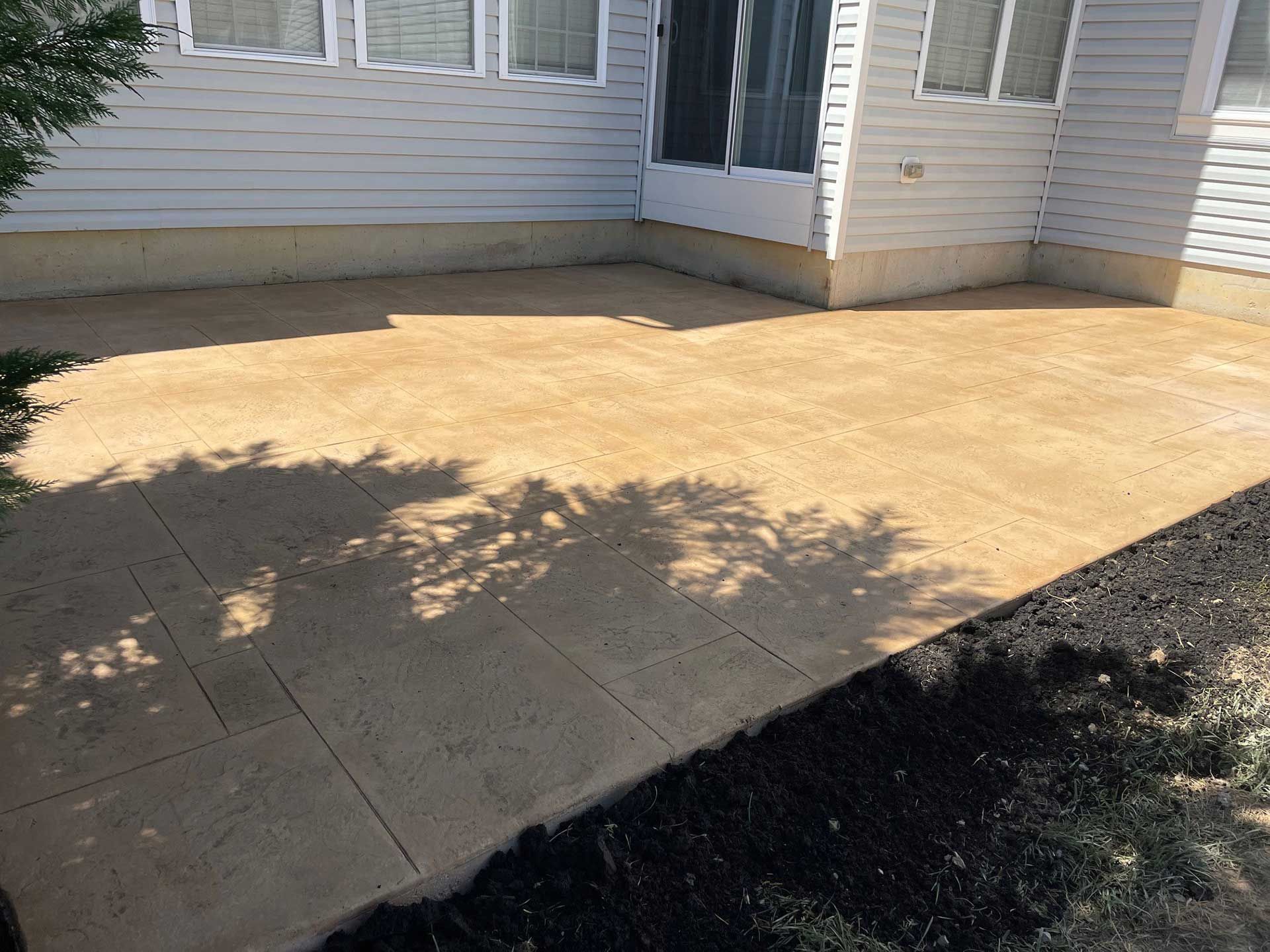 a patio with stamped concrete flooring