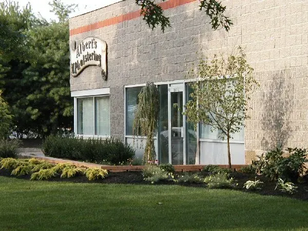 A brick commercial building with a sign reading 