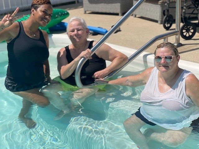 female friends enjoying summer at pool