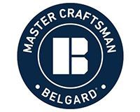 Belgard Master Craftsman circular logo in navy blue and white with stylized “B” icon