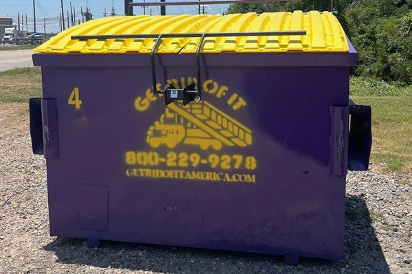 A purple dumpster with the number 4 on it