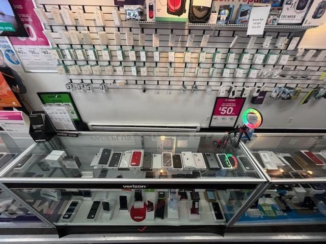 Several boxes of iphones are on display in a store