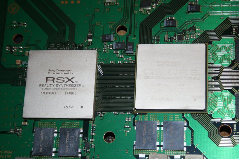 Two rsx chips are sitting on top of a green motherboard