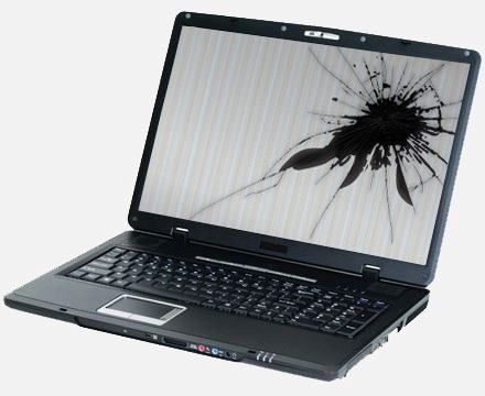 A laptop with a broken screen on a white background