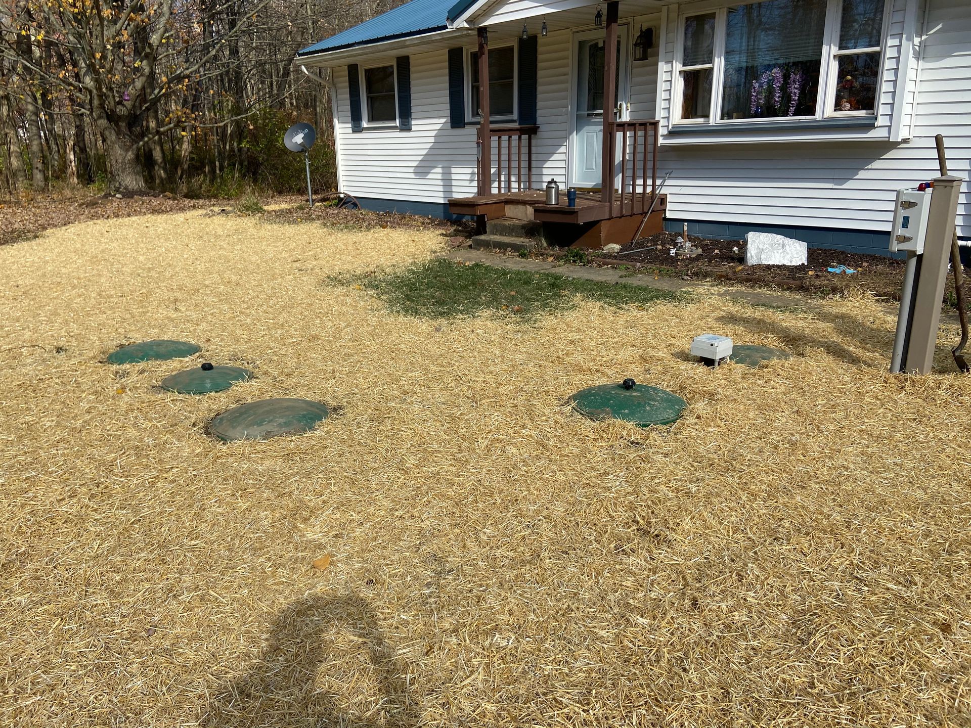 A house with a lot of gravel in front of it