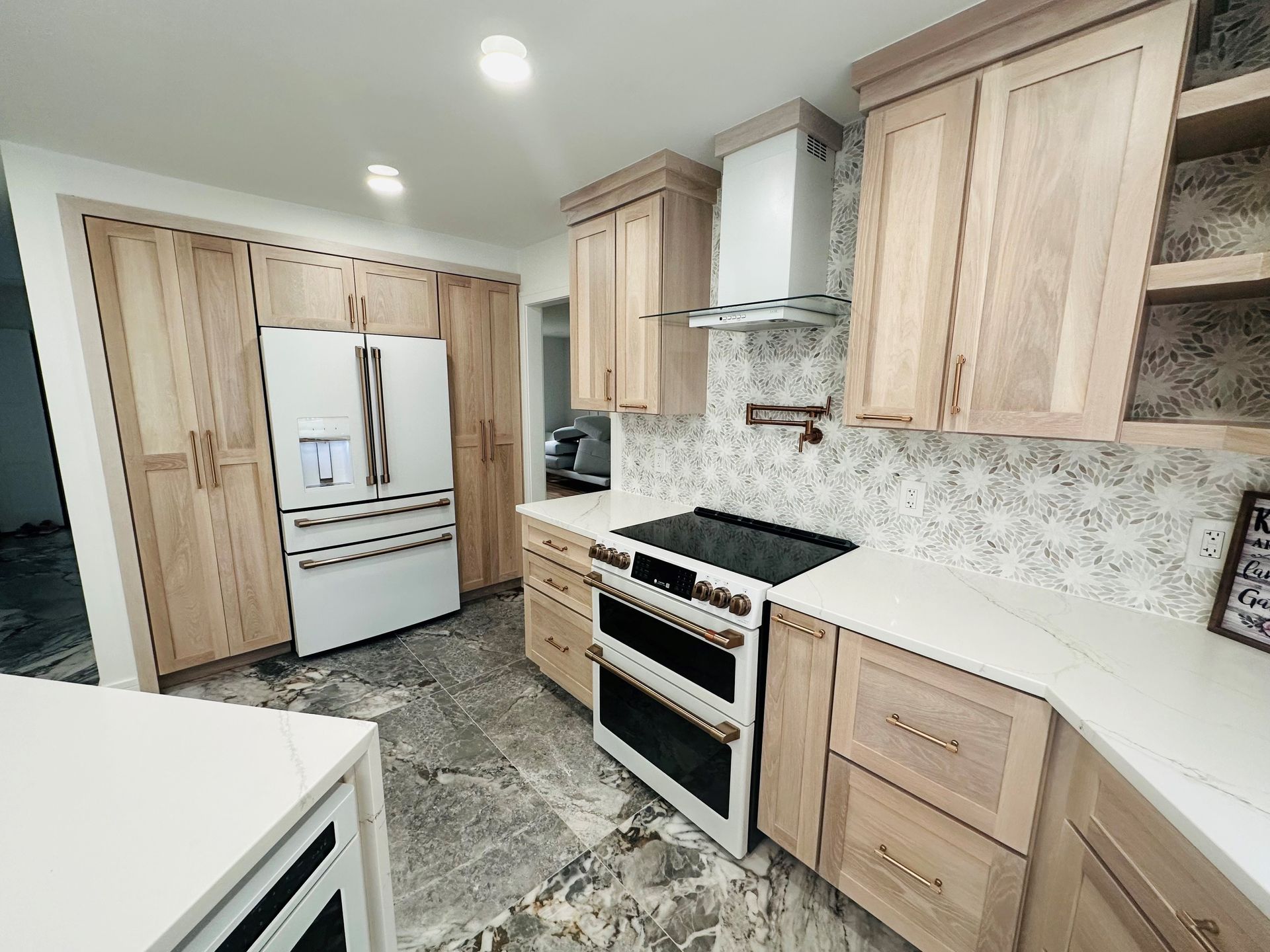 A kitchen with wooden cabinets and stainless steel appliances.