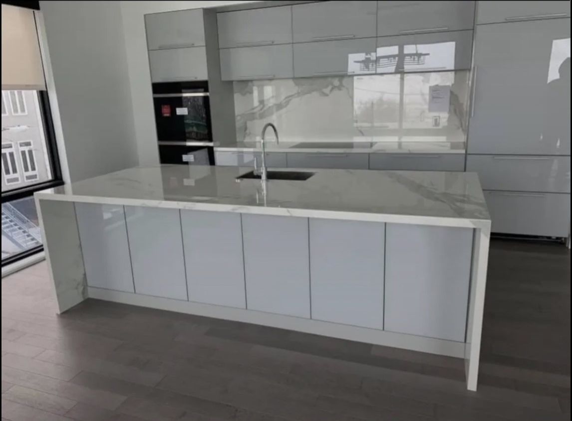A living room with a fireplace and a flat screen tv on the wall.