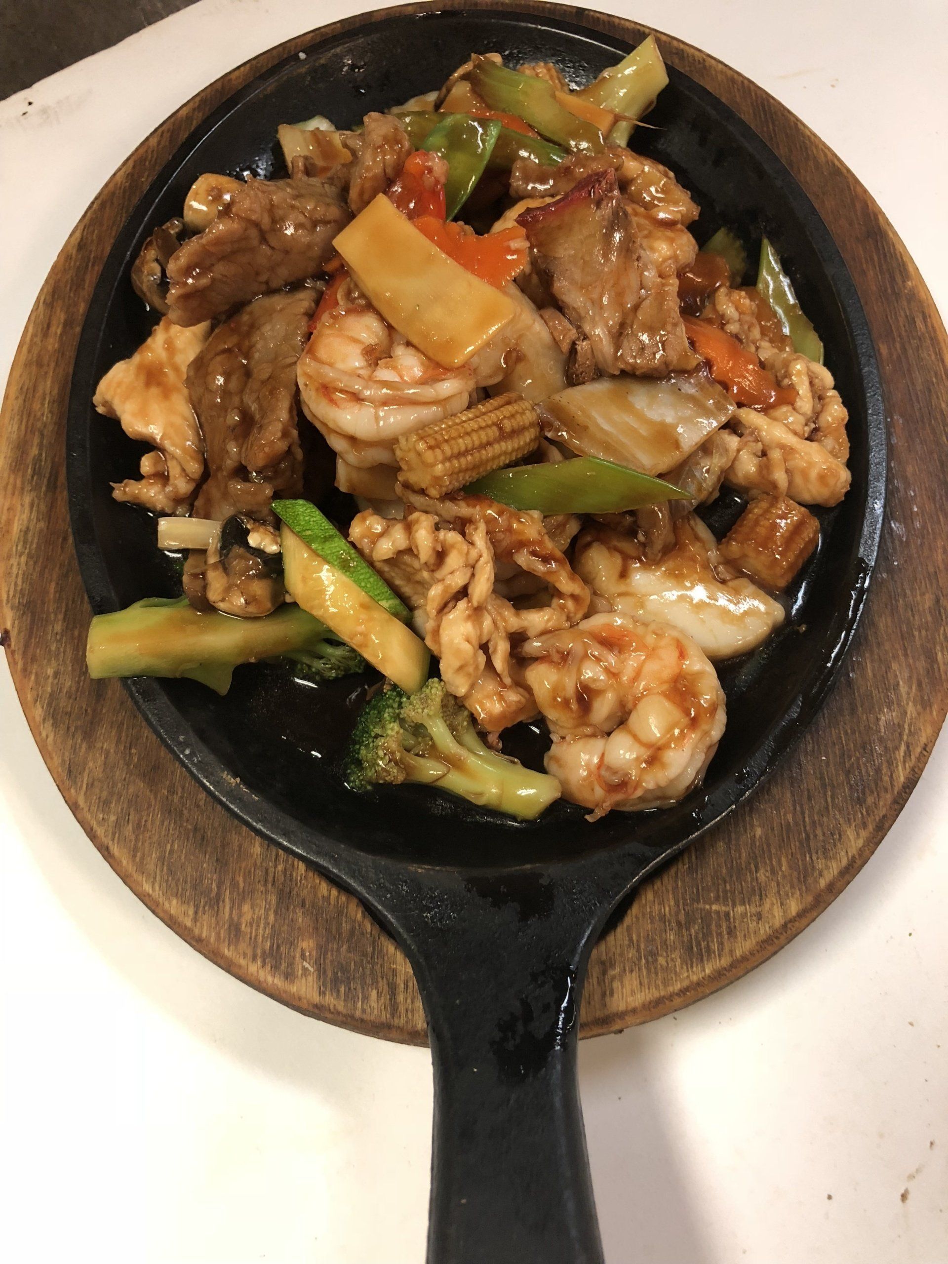 Meat and shrimp on skillet