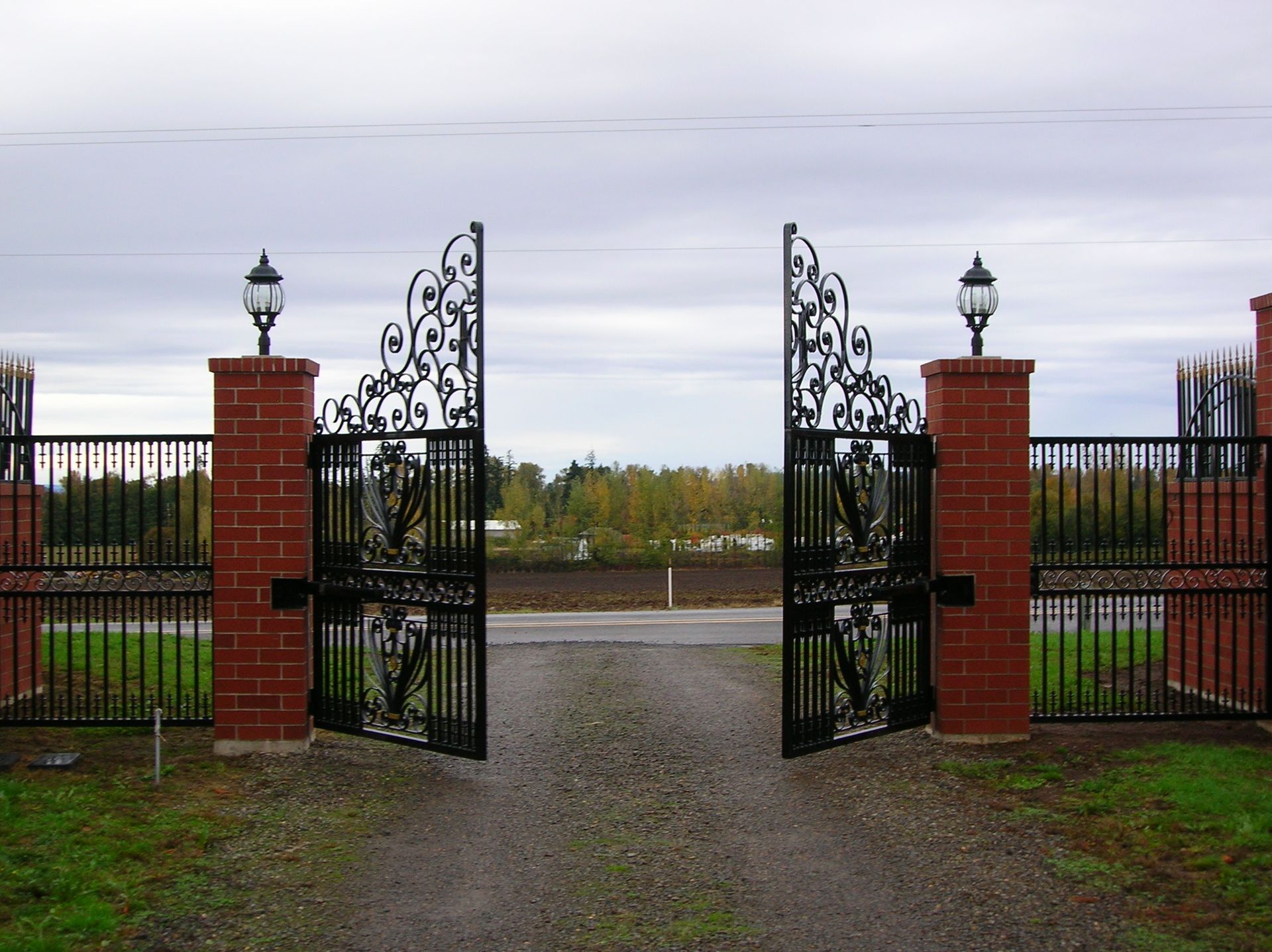 There is a large gate in front of a house.