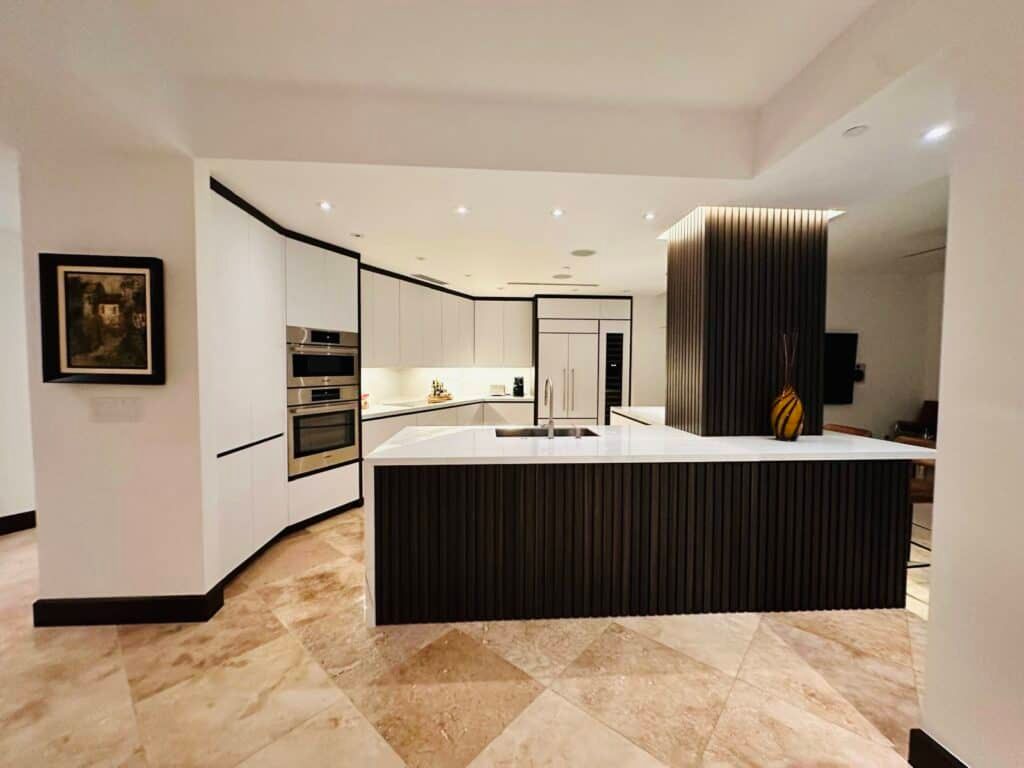 A kitchen with a large island in the middle of it