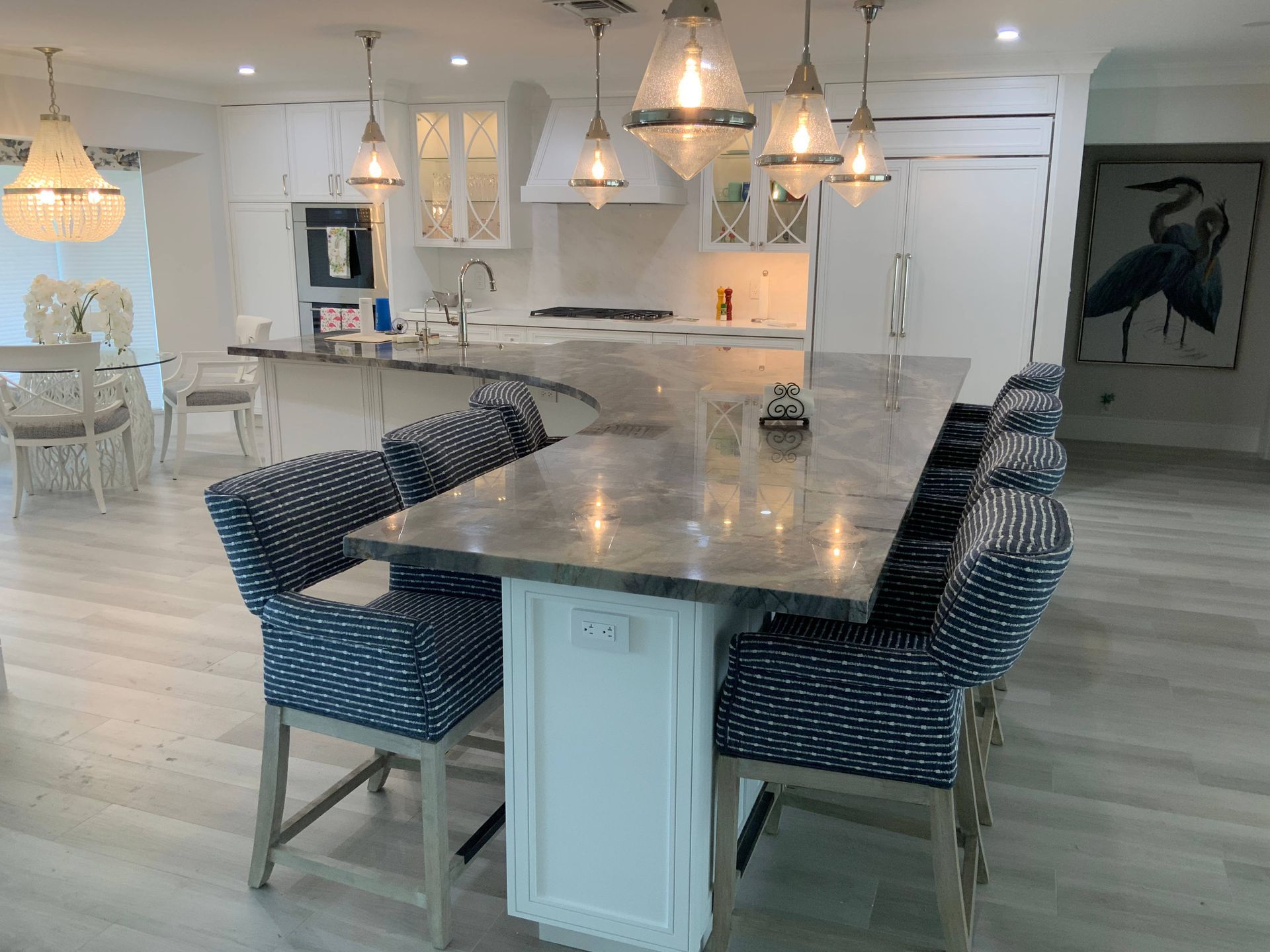 A kitchen with a table and chairs in it