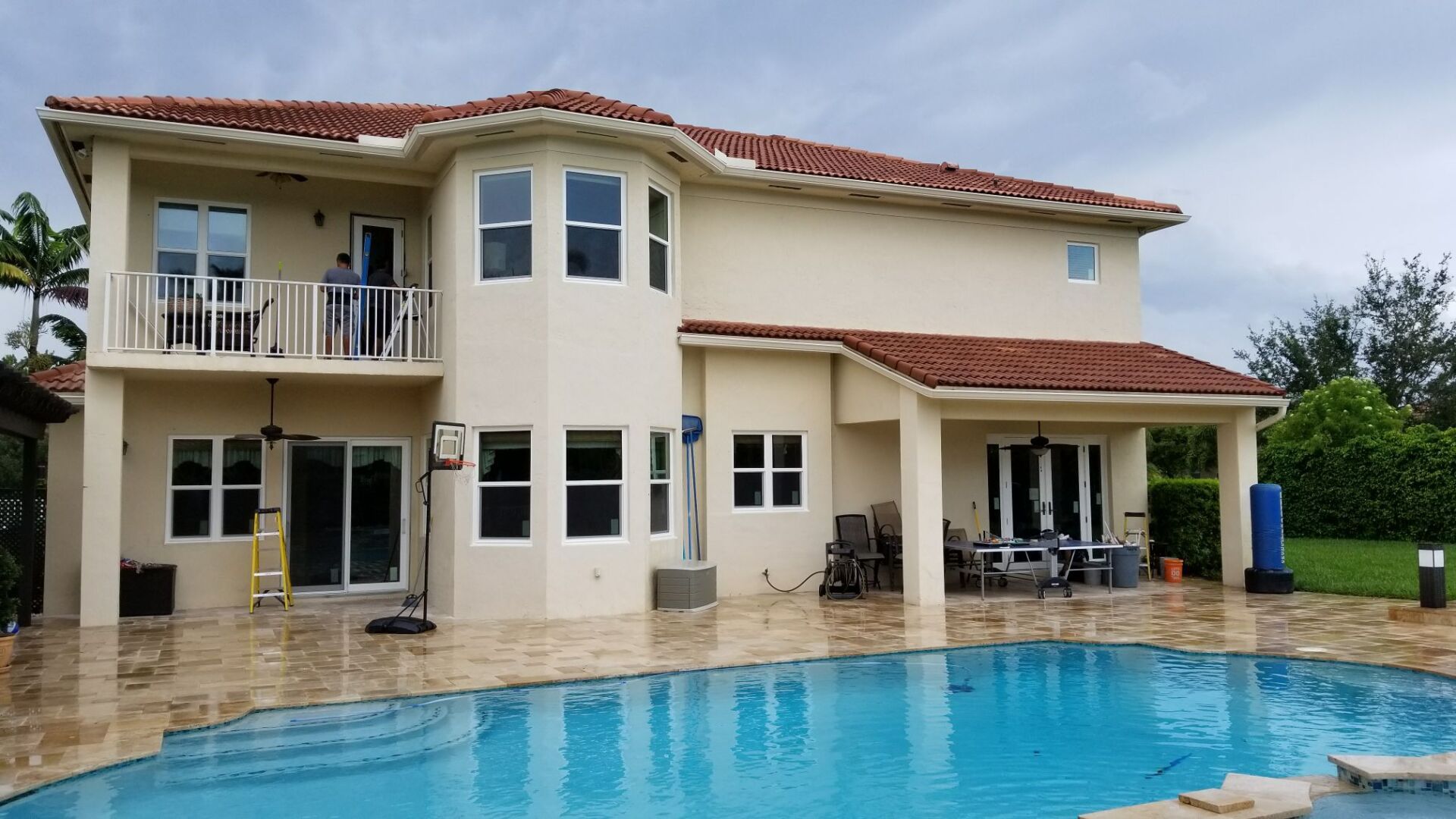 House with glass windows and swimming pool
