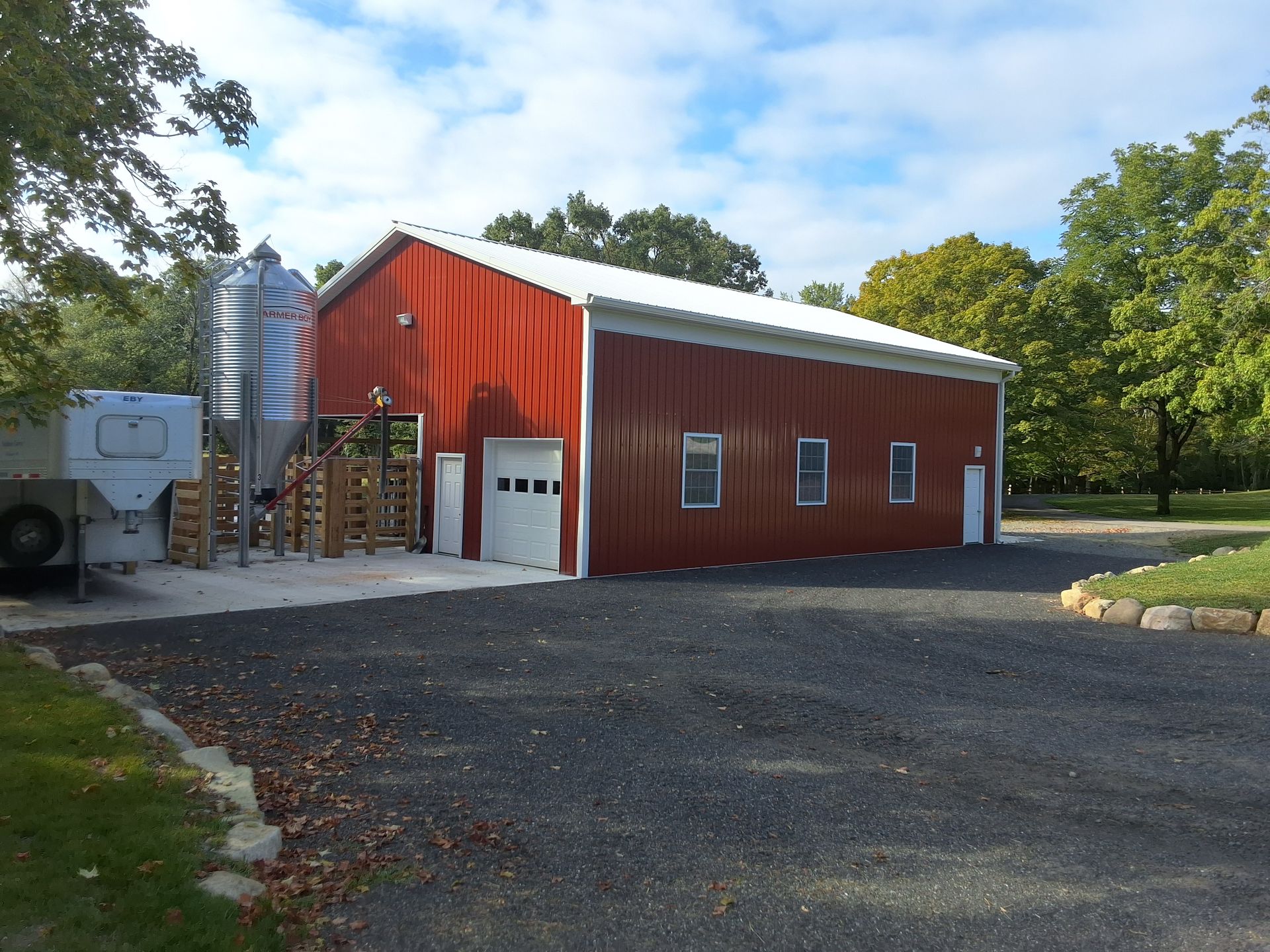 A large red barn with a white roof