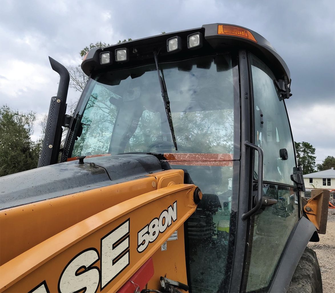 A case 580w tractor with a new windshield