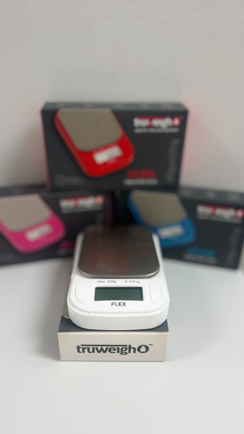 A truweight scale is sitting on top of a box