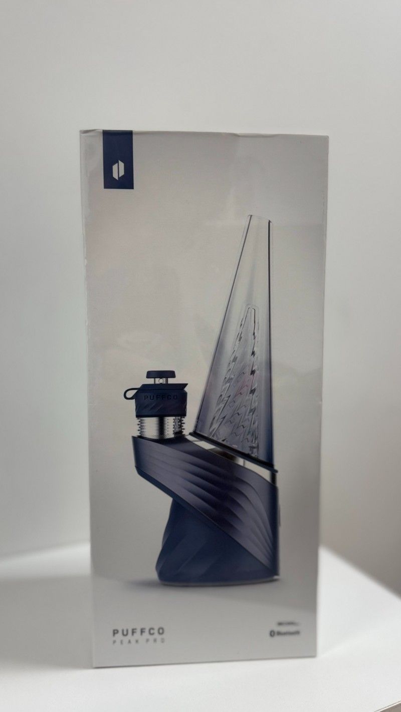 A box with a boat on it is sitting on a table.
