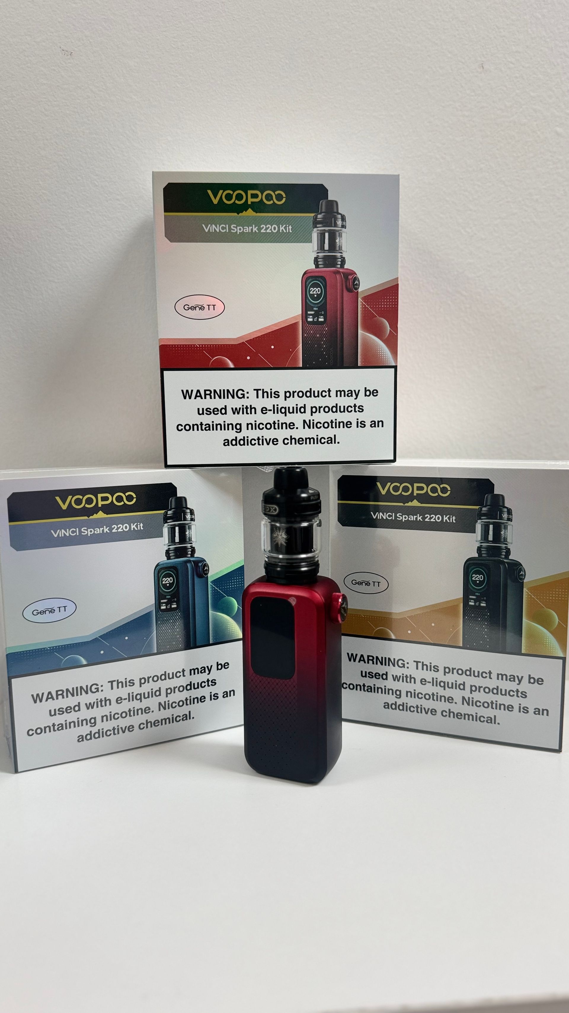 A group of electronic cigarettes sitting on top of each other on a table.