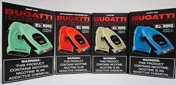Four boxes of bugatti electronic cigarettes are lined up on a table