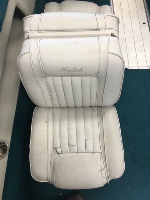 A white boat seat with the word martin on it