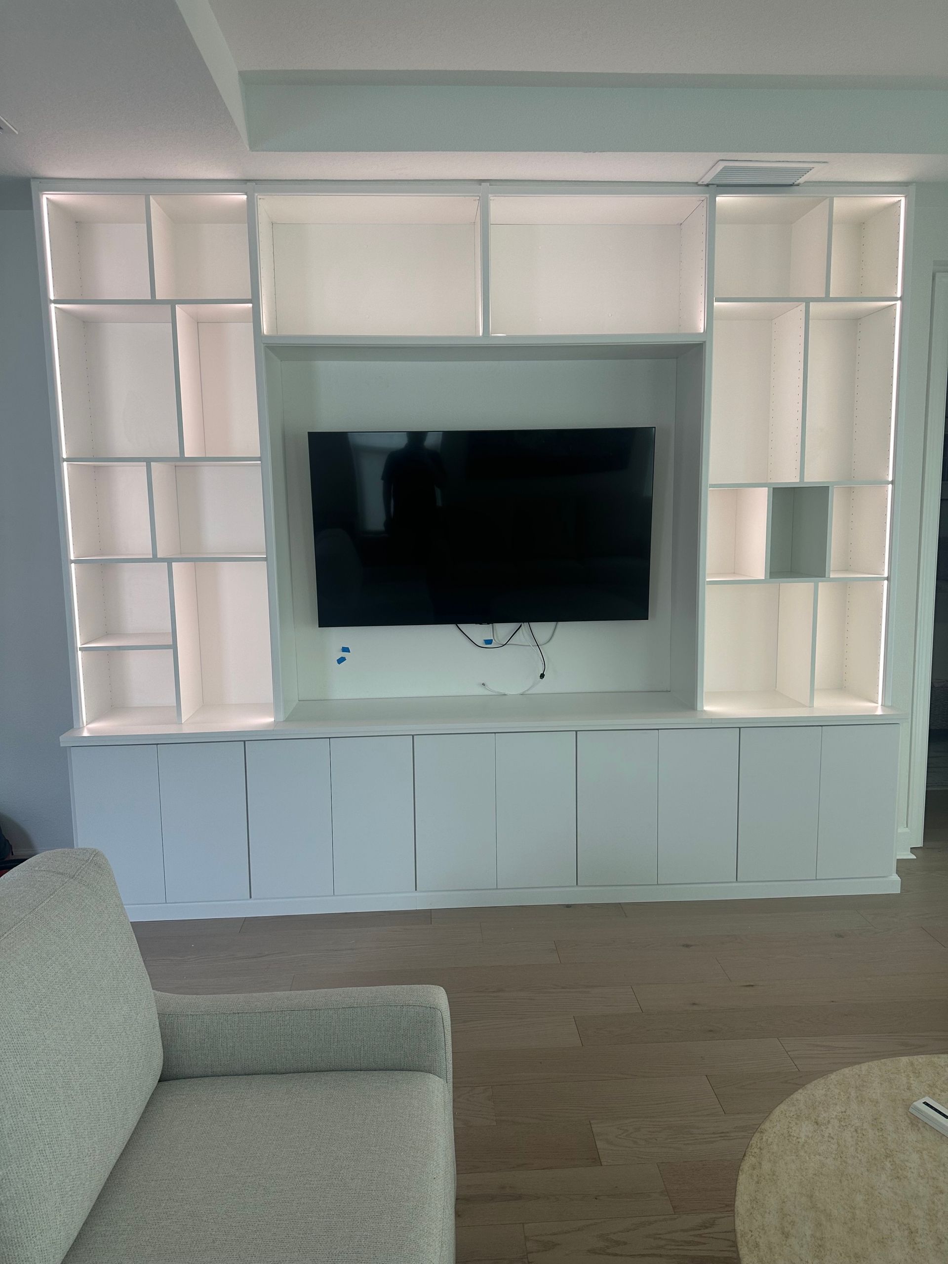 A living room with a couch and a flat screen tv
