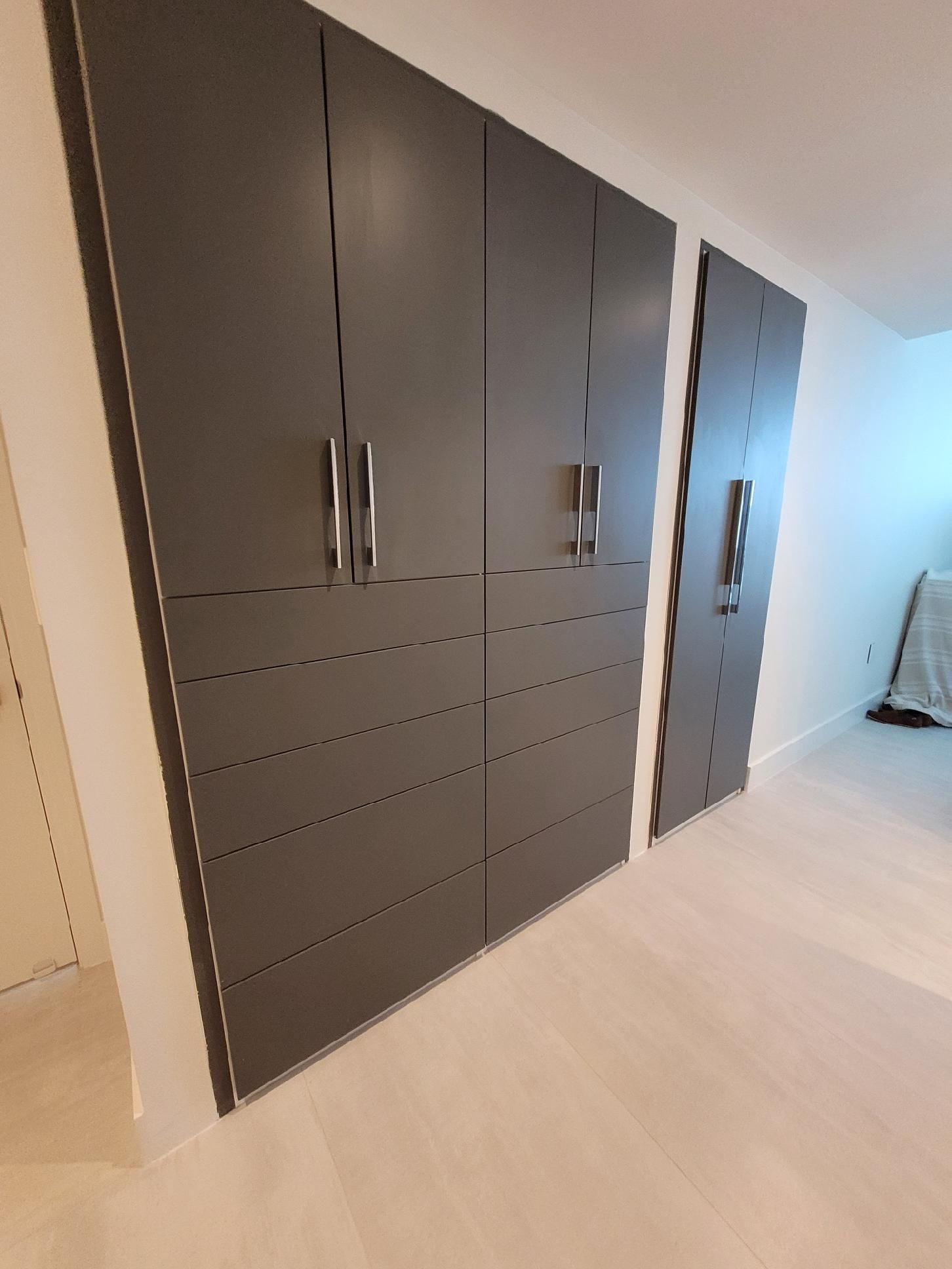 A room with a lot of cabinets and drawers in it