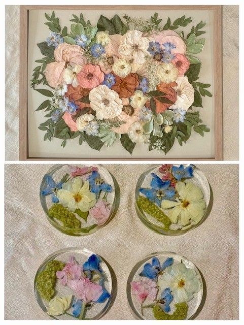Framed floral painting above four small glass dishes with pastel flowers and blue butterflies.