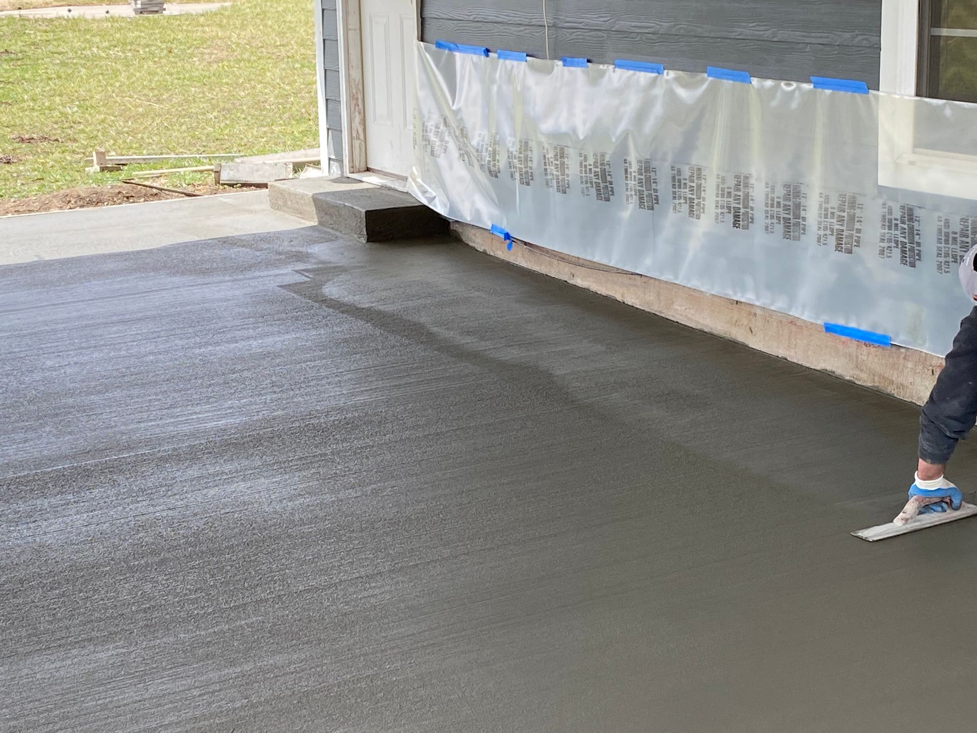 The experts from SR Coffman Construction Inc. are working carefully on a concrete walkway