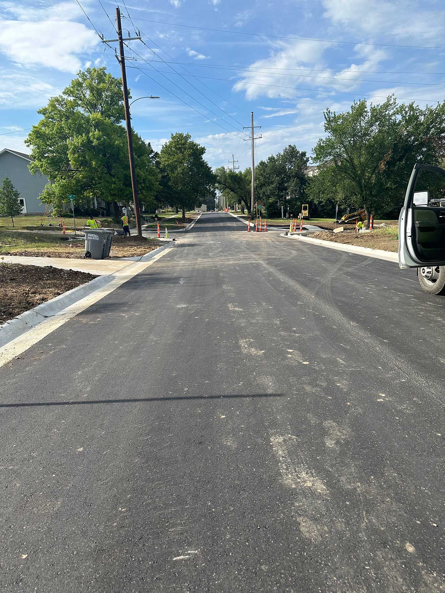 a vehicle is parked on the side of a concrete road