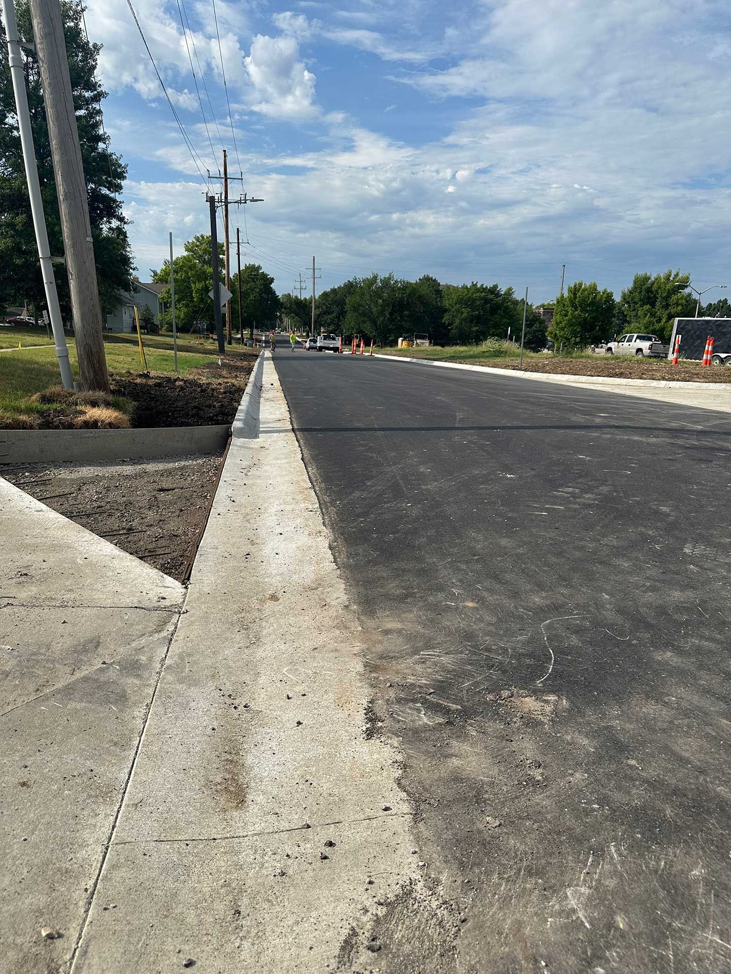 a concrete curb on the side of a road .