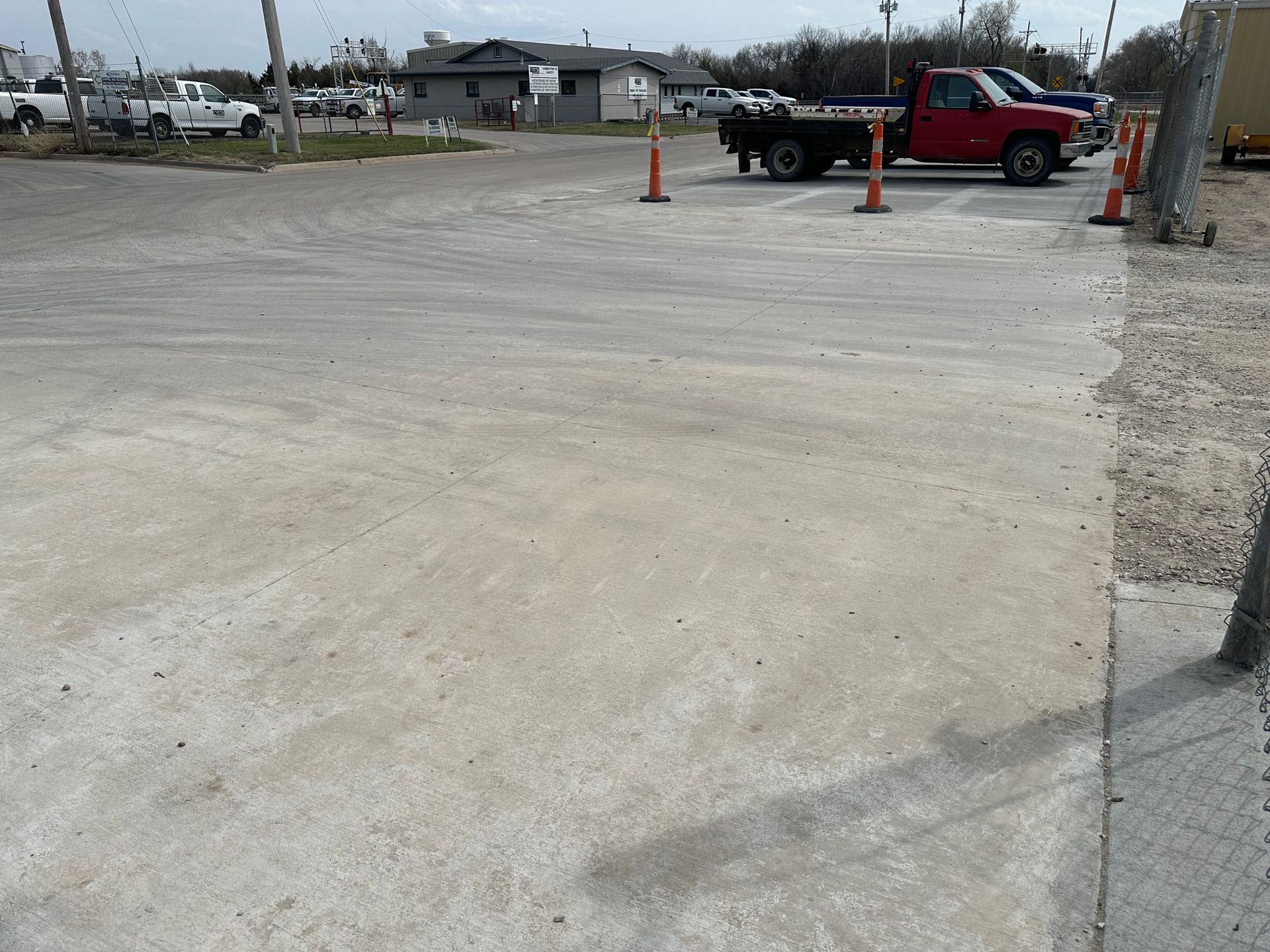 a red truck is parked in a parking lot