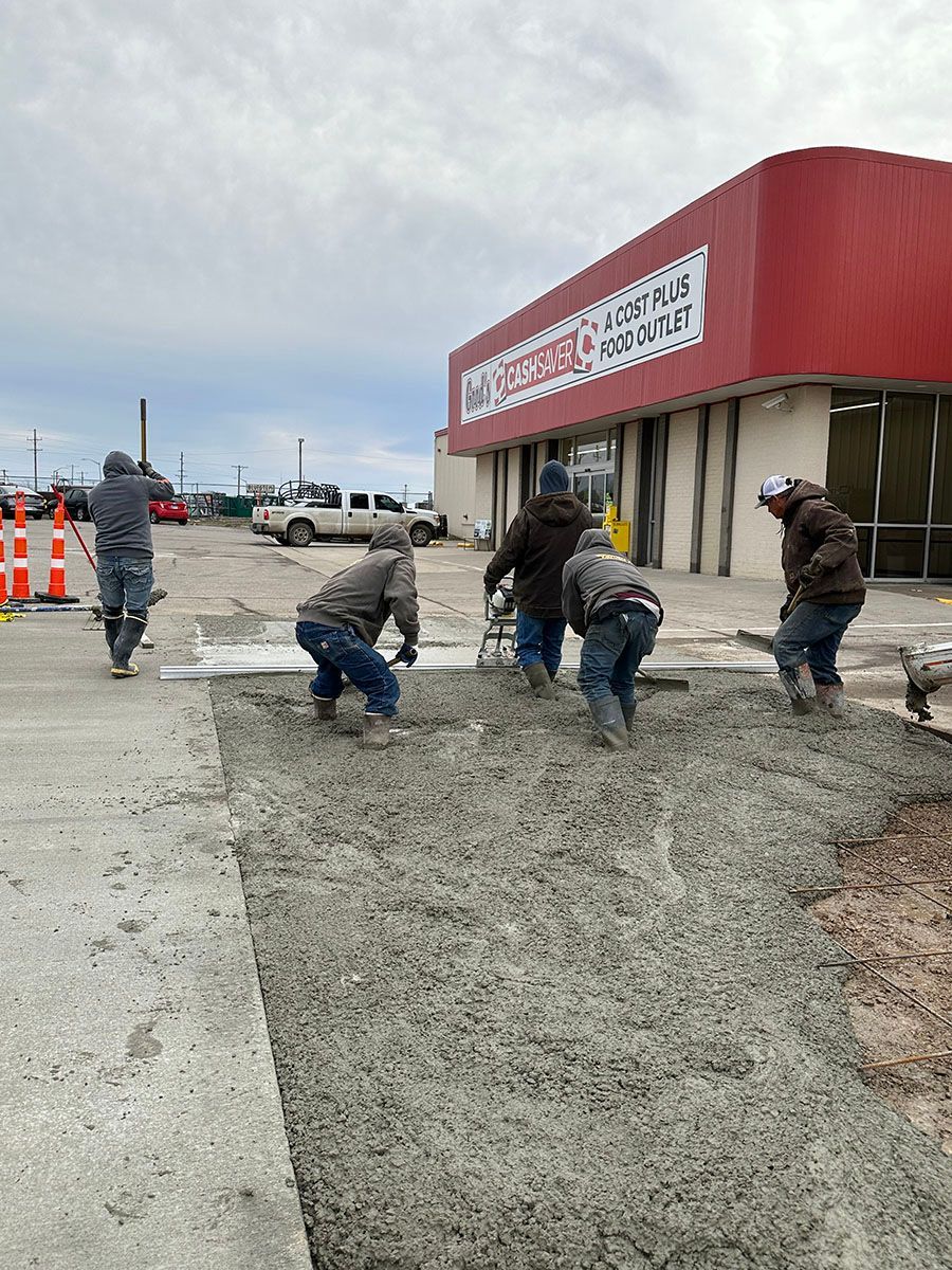 The experts from SR Coffman Construction Inc. are laying concrete evenly