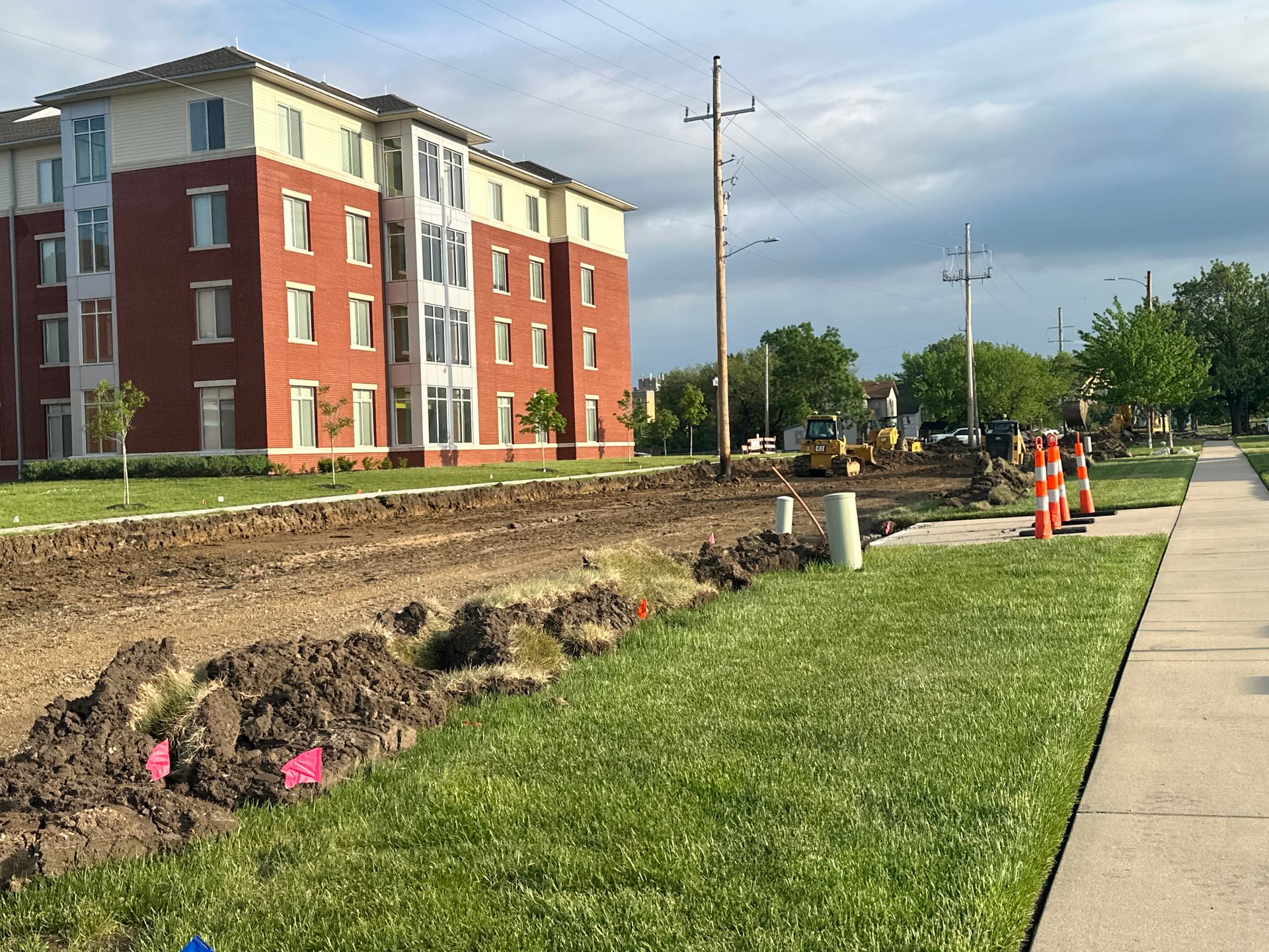 a large brick building with a lot of dirt in front of it