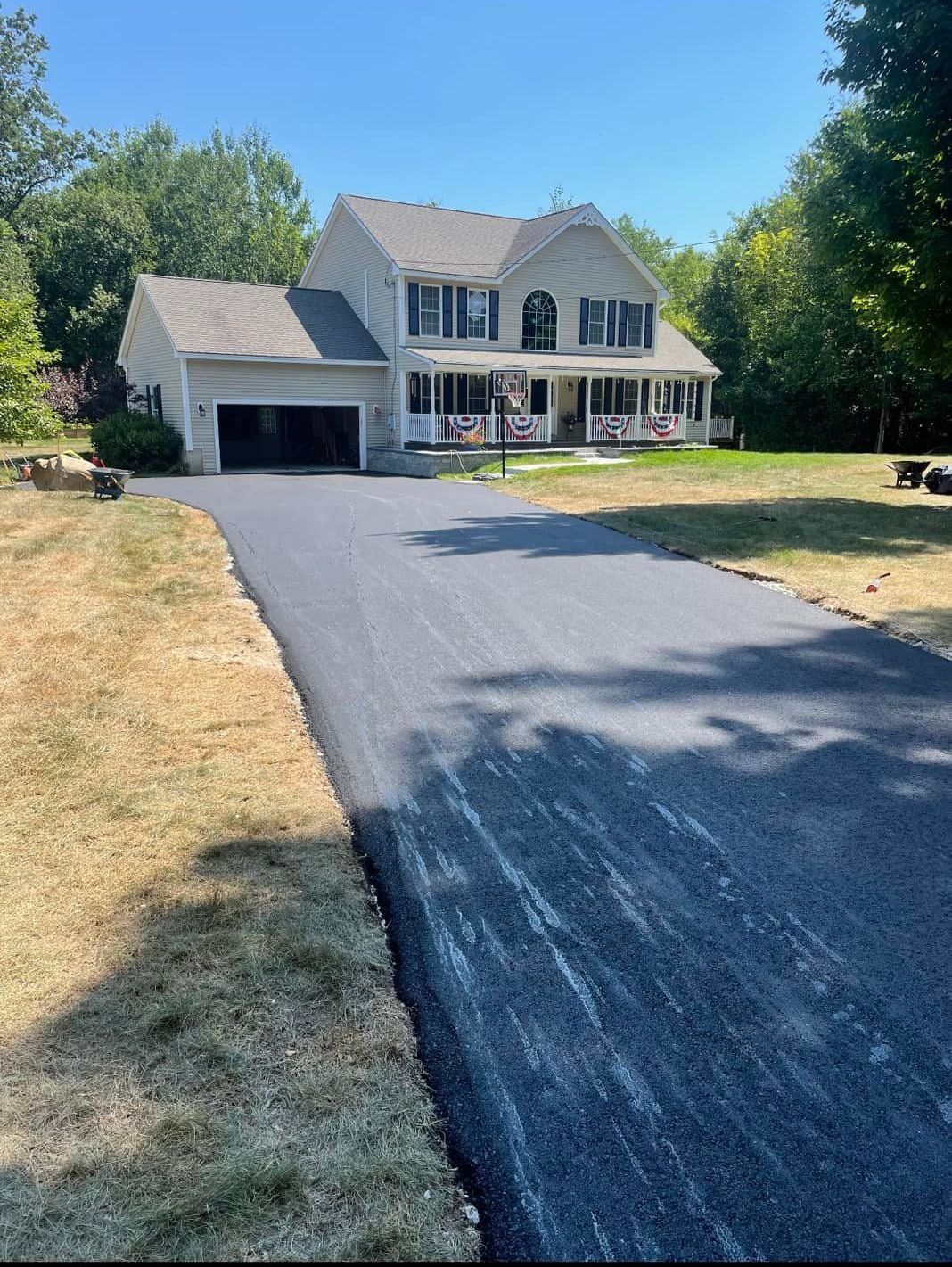 A large house with a driveway leading to it.