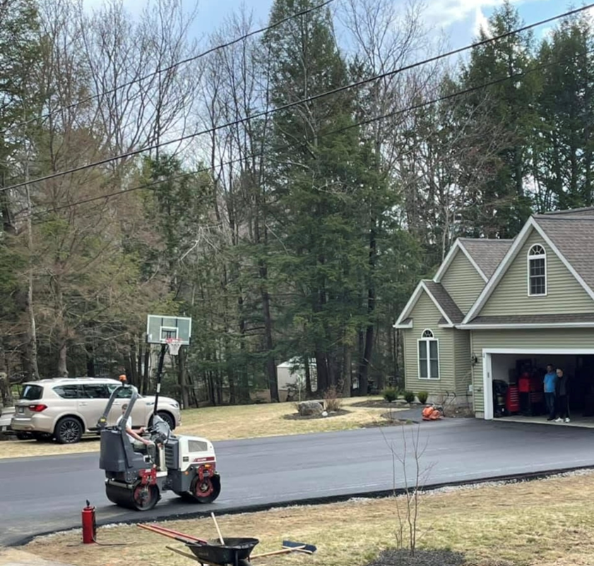 A house with a basketball hoop in front of it